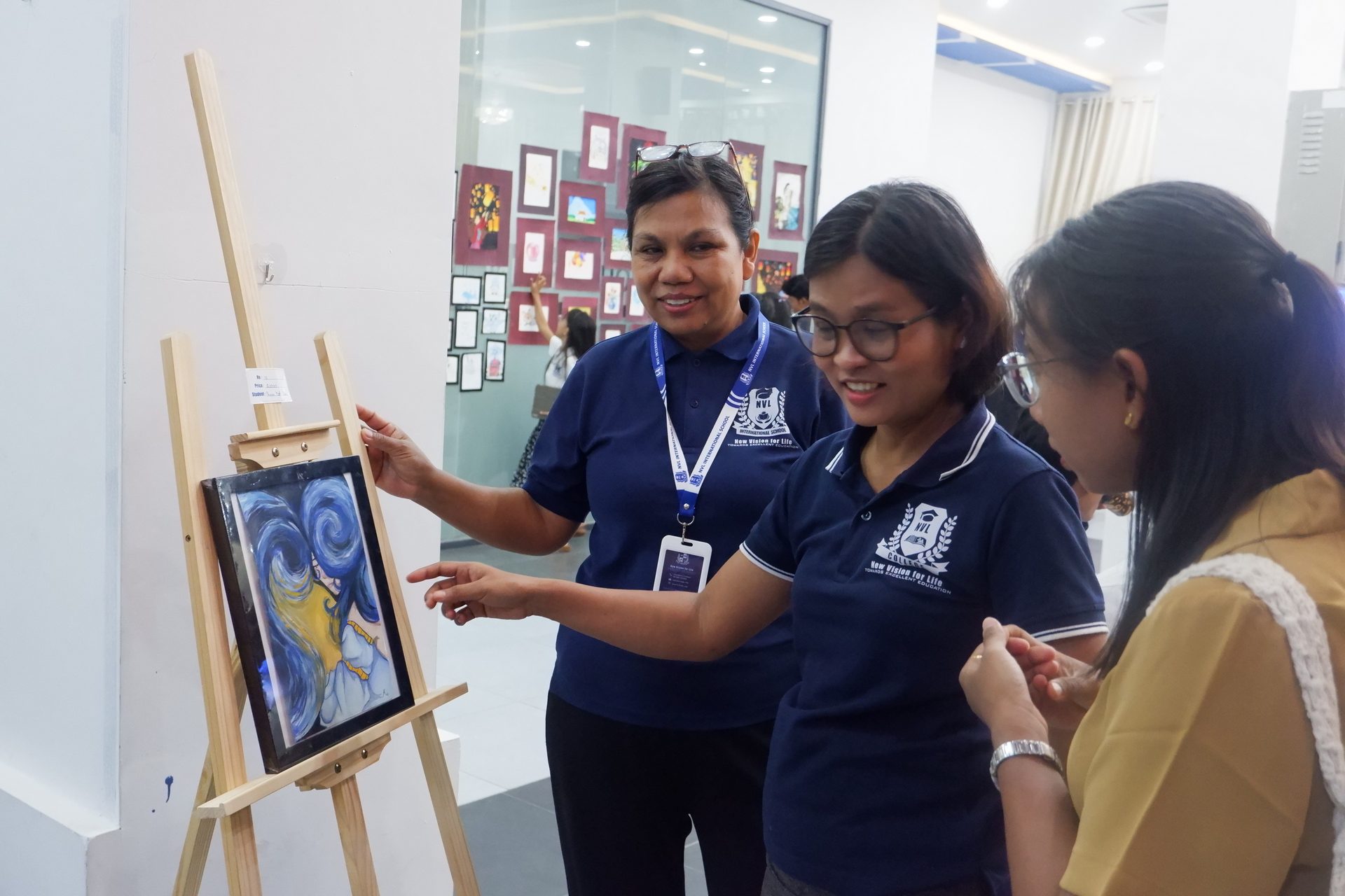 Teachers and students discussing artwork