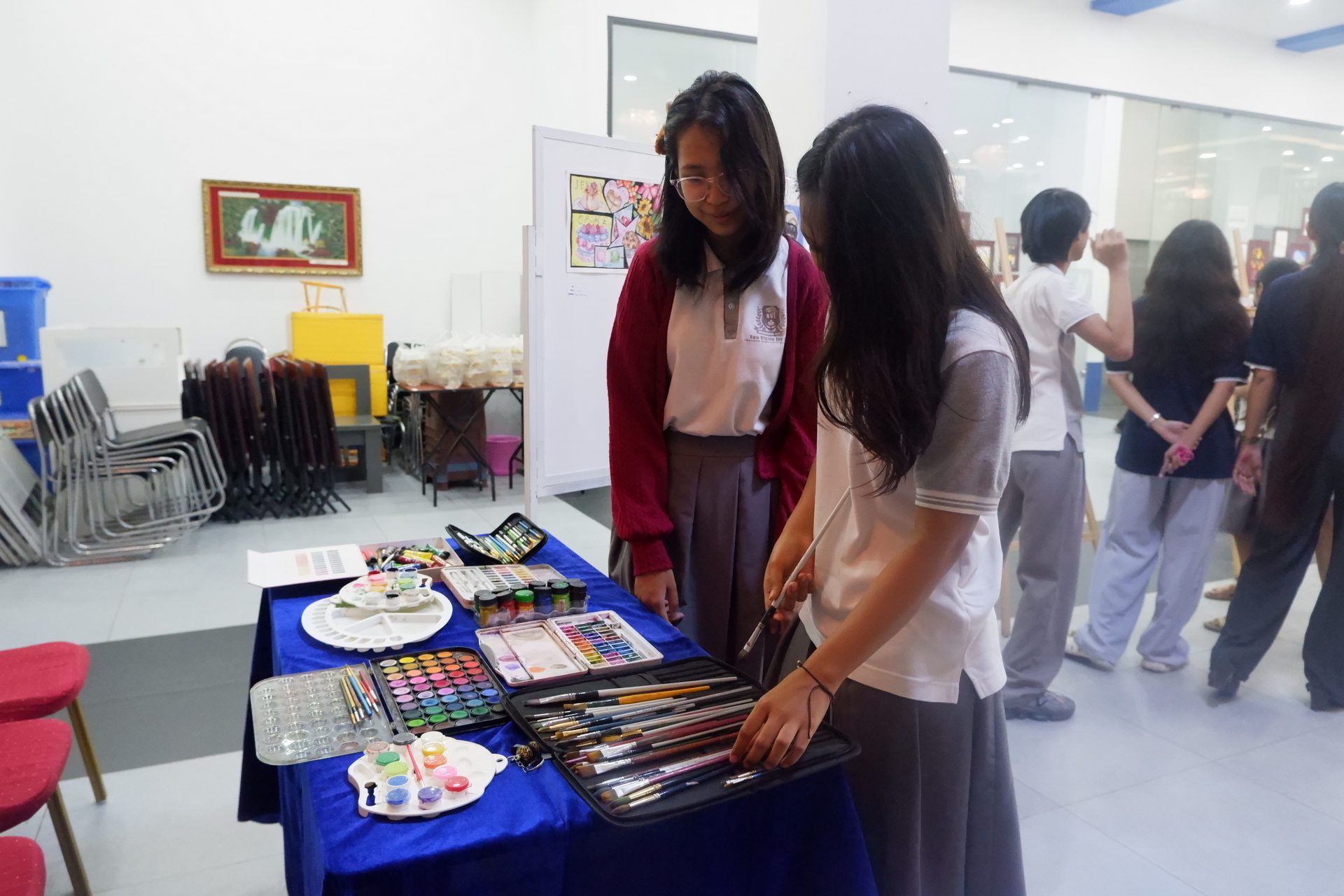 Students exploring art materials and work