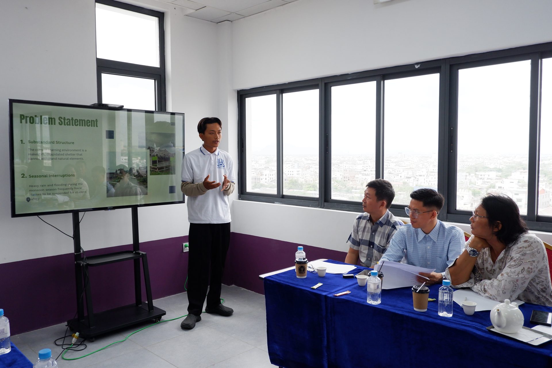 College learner presenting to an assessment panel